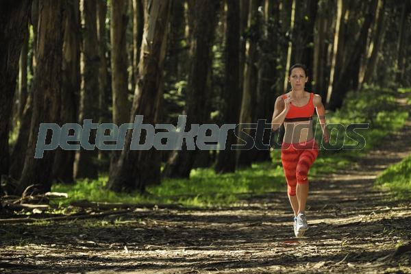Shannon-Rowbury;professional-runner;athlete;5000-meters;1500-meters;bronze-medalist;olypmian;female;woman;Nike;sponsored;the-Presidio;trail;path;orange;eucolyptus-trees;training;sunset;form;horizontal